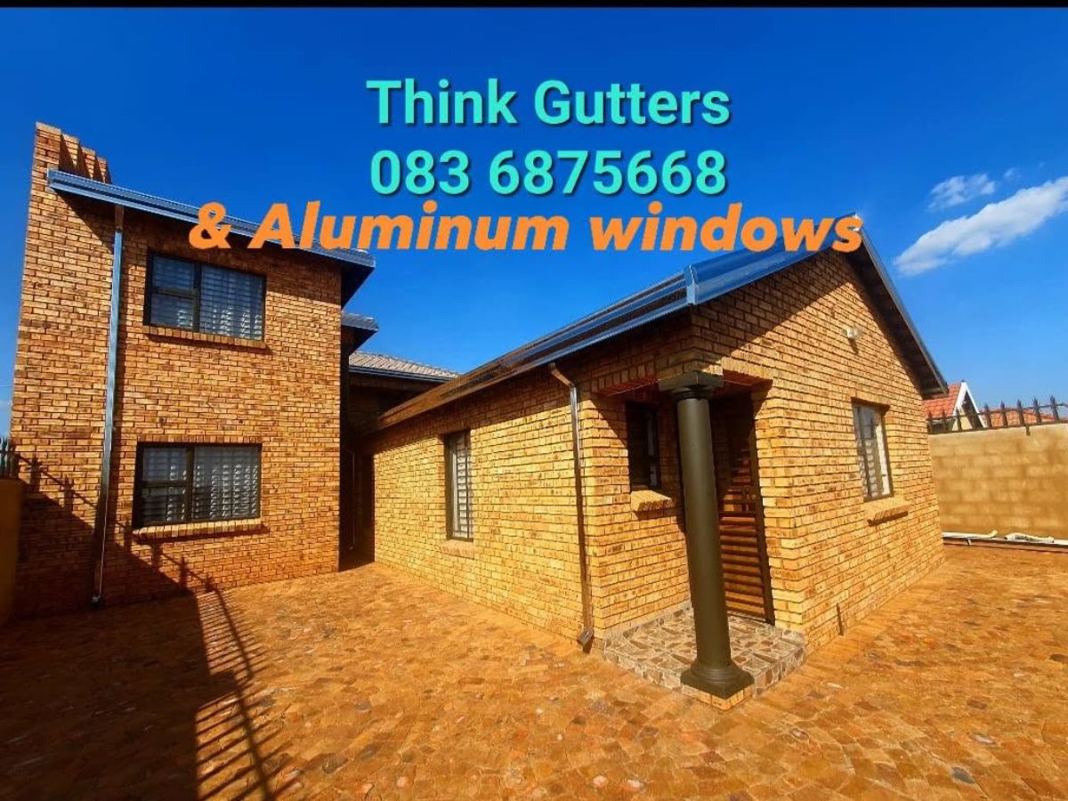 Charcoal gutters on a face brick home